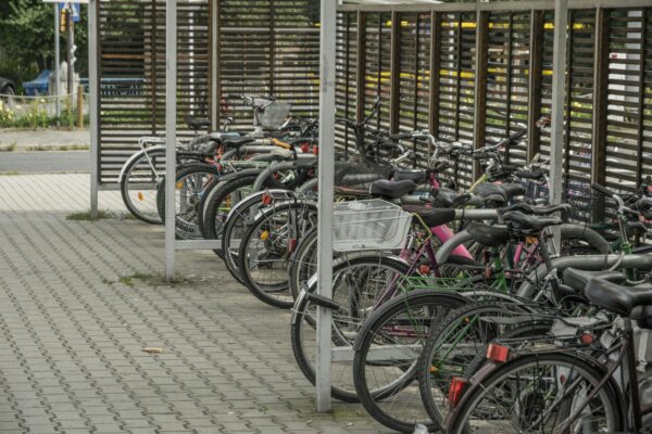Bicycles parked in an outdoor urban lot in Wrocław, Poland.